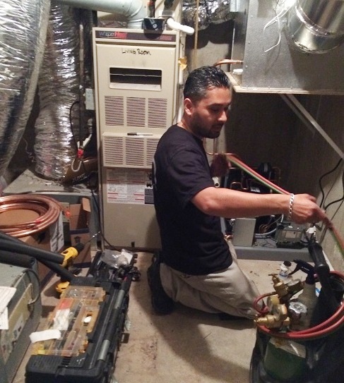 Mario Morales, founder of M&M Cellar Systems, is Welding the Refrigeration Lines for the Wine Cellar Beverly Hills Project